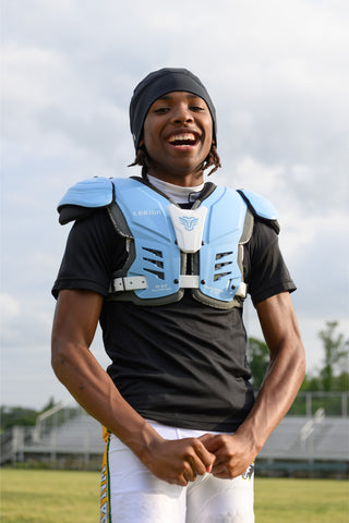 Youth wearing LEGION M-80 Youth University Football Shoulder Pads