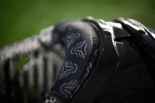 Close up of the LEGION M-250 Varsity Football Shoulder Pads with a green background