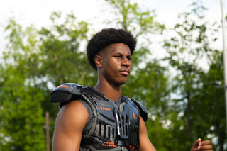Young man wearing LEGION M-250 Varsity Football Shoulder Pads